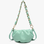 Mint green handbag with a chain strap close-up