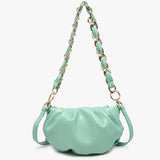 Mint green handbag with a chain strap close-up