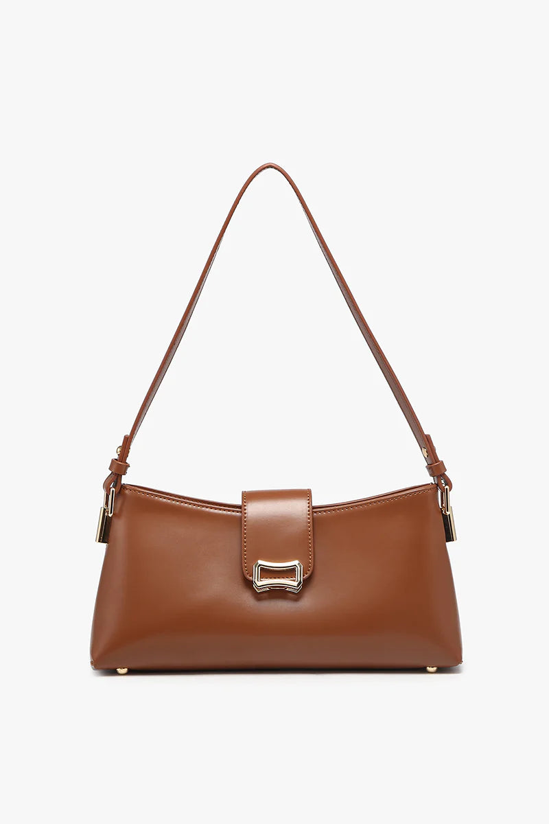 Brown handbag with a strap close-up