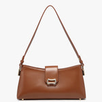 Brown handbag with a strap close-up