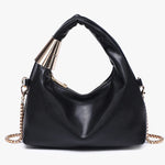 Black handbag with gold chain close-up