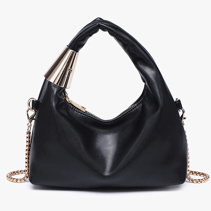 Black handbag with gold chain close-up
