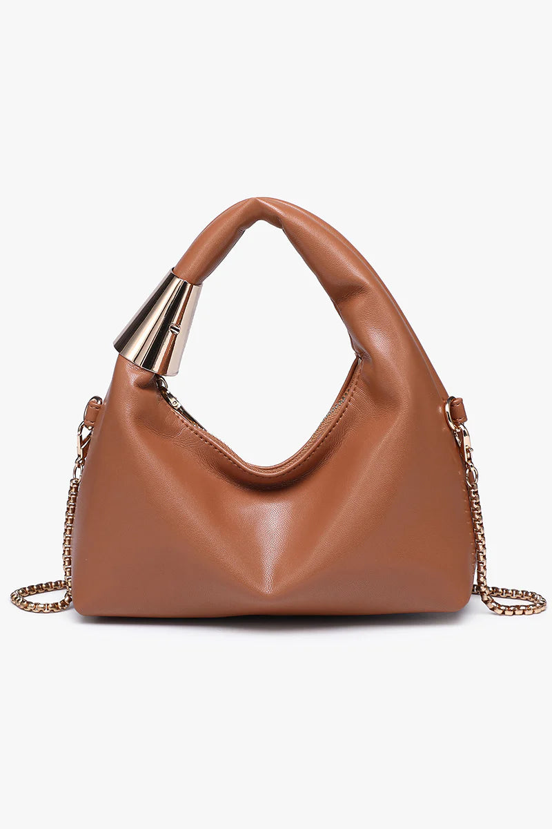 Brown handbag with gold chain and handle close-up