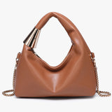 Brown handbag with gold chain and handle close-up