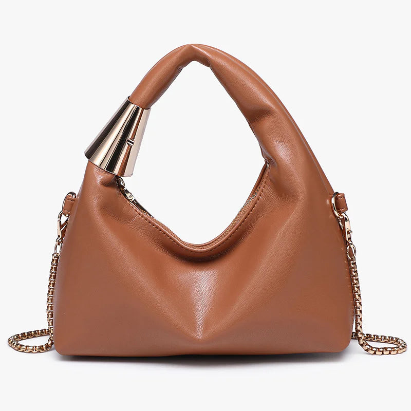 Brown handbag with gold chain and handle close-up