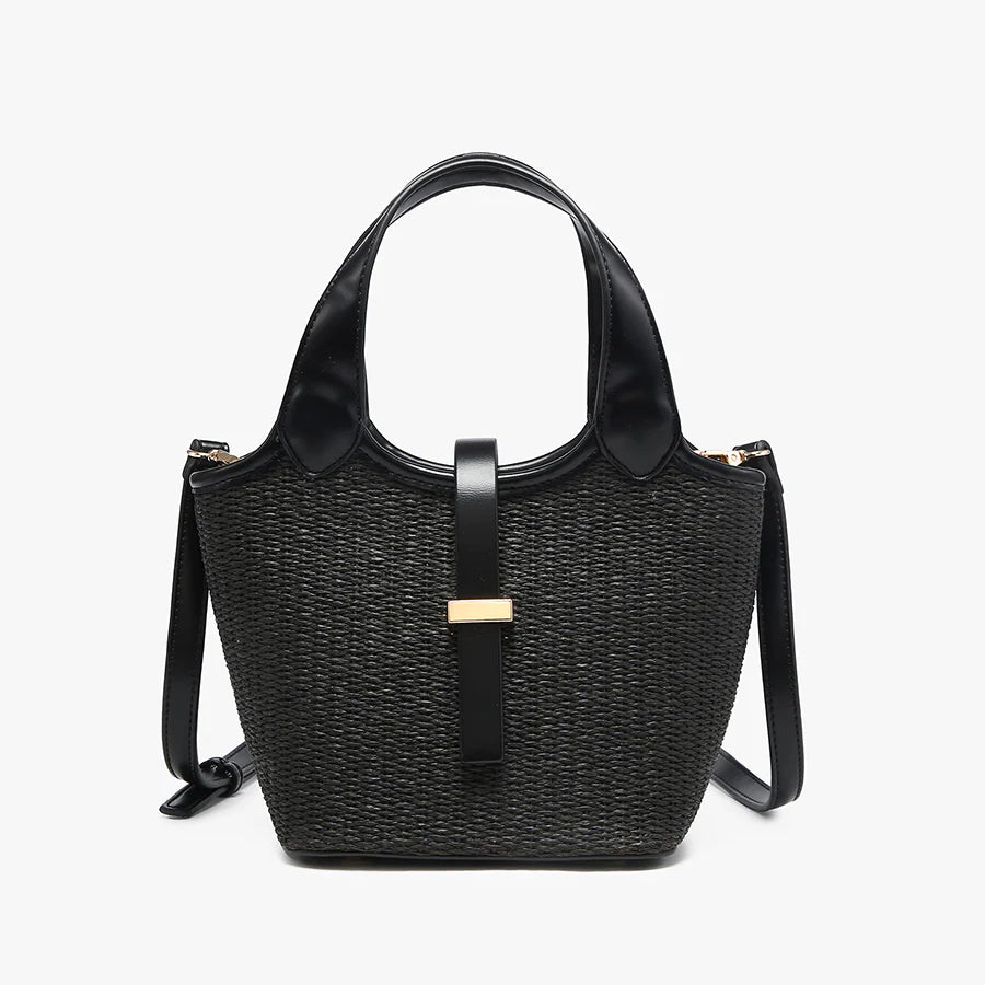 Black woven handbag with leather straps close-up