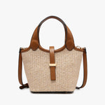 Woven handbag with brown leather accents close-up