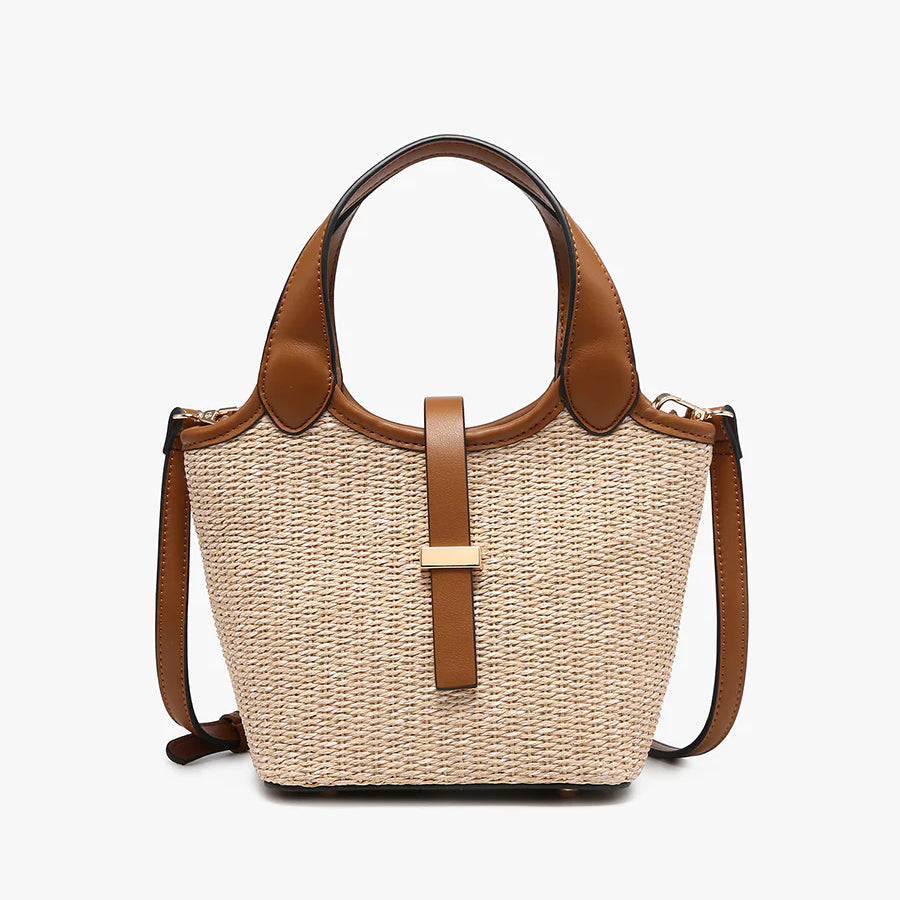 Woven handbag with brown leather accents close-up