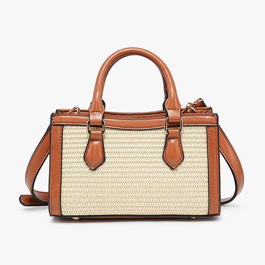 Handbag with straw-like texture and brown leather accents close-up