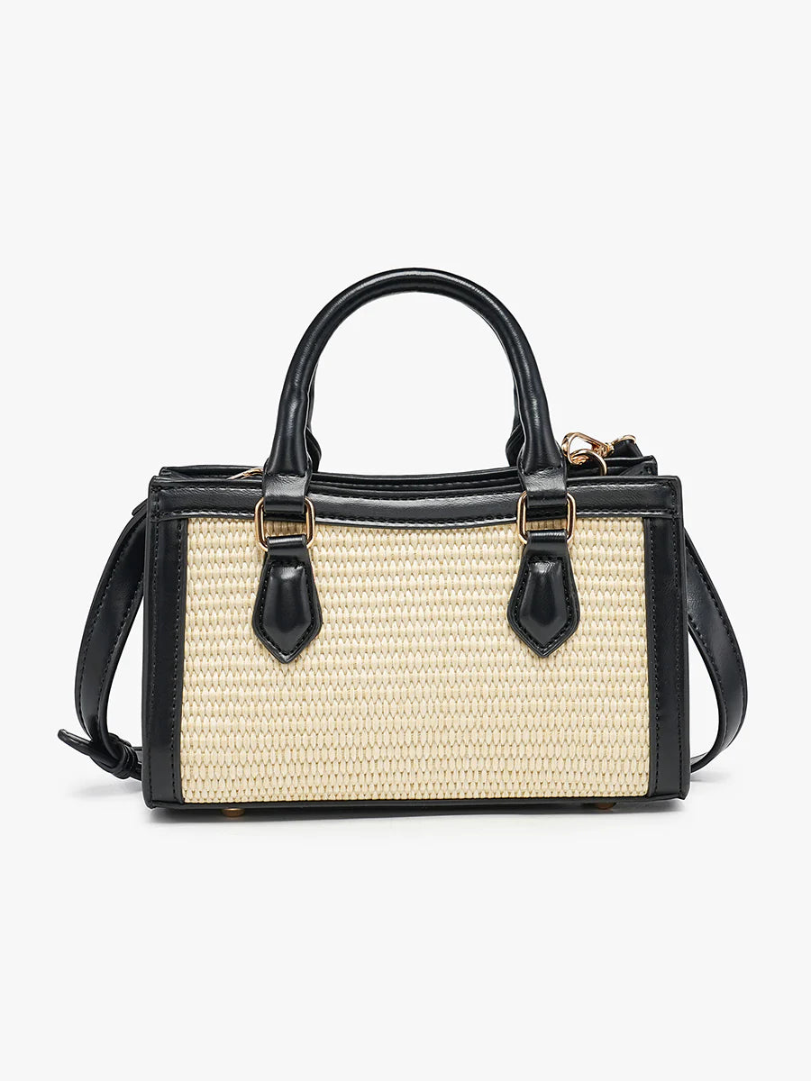 Black and beige handbag with straw texture close-up