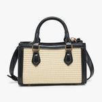 Black and beige handbag with straw texture close-up