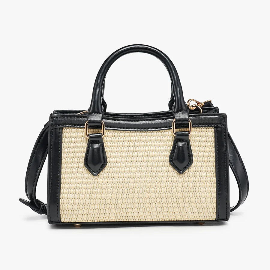 Black and beige handbag with straw texture close-up