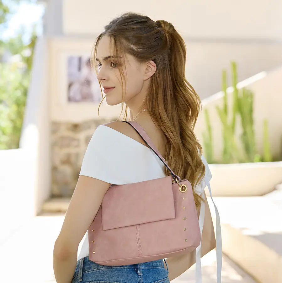Pink handbag with gold accents model