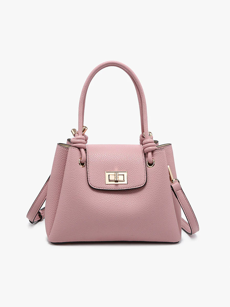 Mauve handbag with a strap close-up