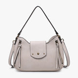 Light gray handbag with tassels and a strap close-up
