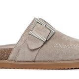 Light brown suede slipper with a strap close-up