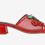 Red heel with decorative cherry elements close-up