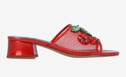 Red heel with decorative cherry elements close-up