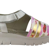 Silver sandal with colorful striped design close-up