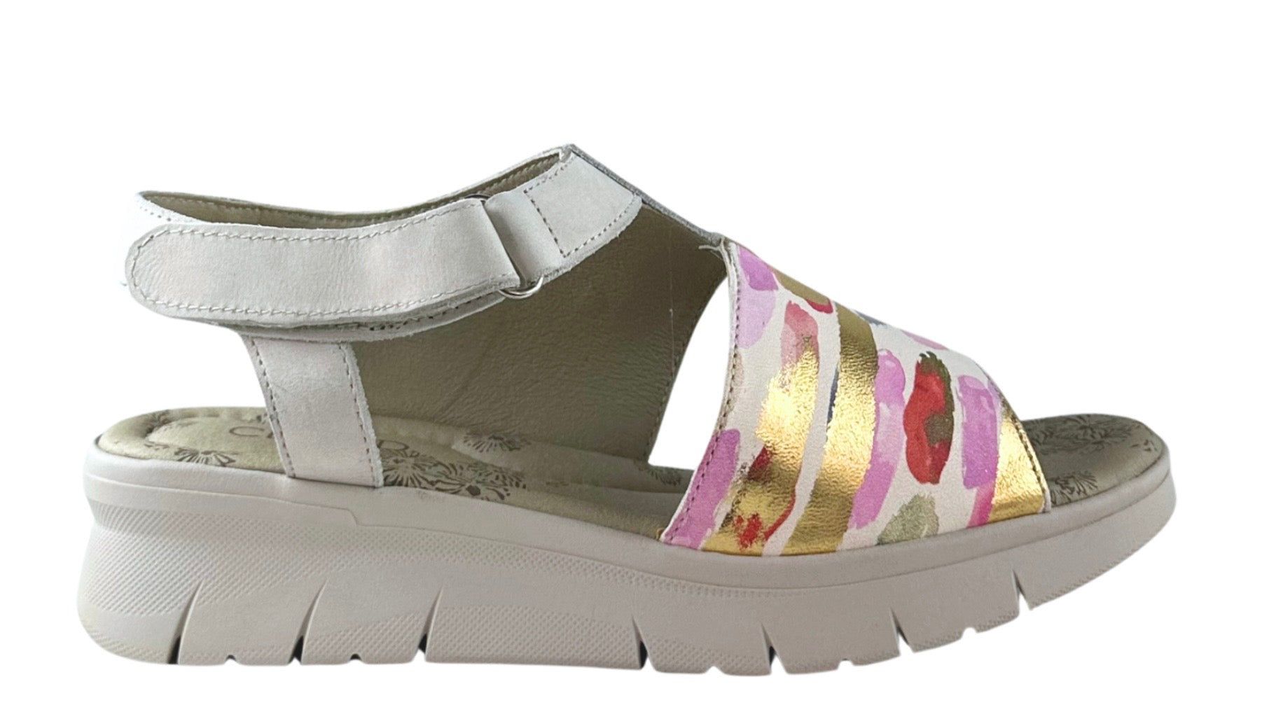 Silver sandal with colorful striped design close-up