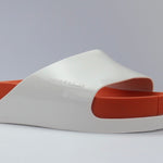 White sandal with a red sole side