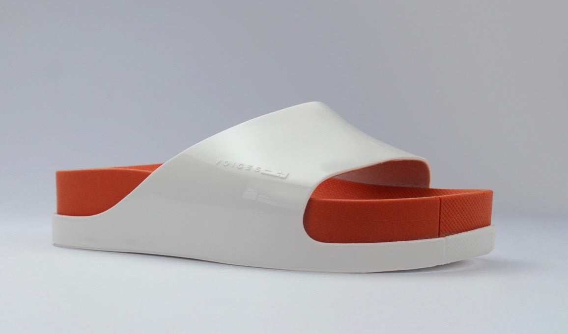White sandal with a red sole side