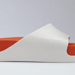 White sandal with a red sole close-up