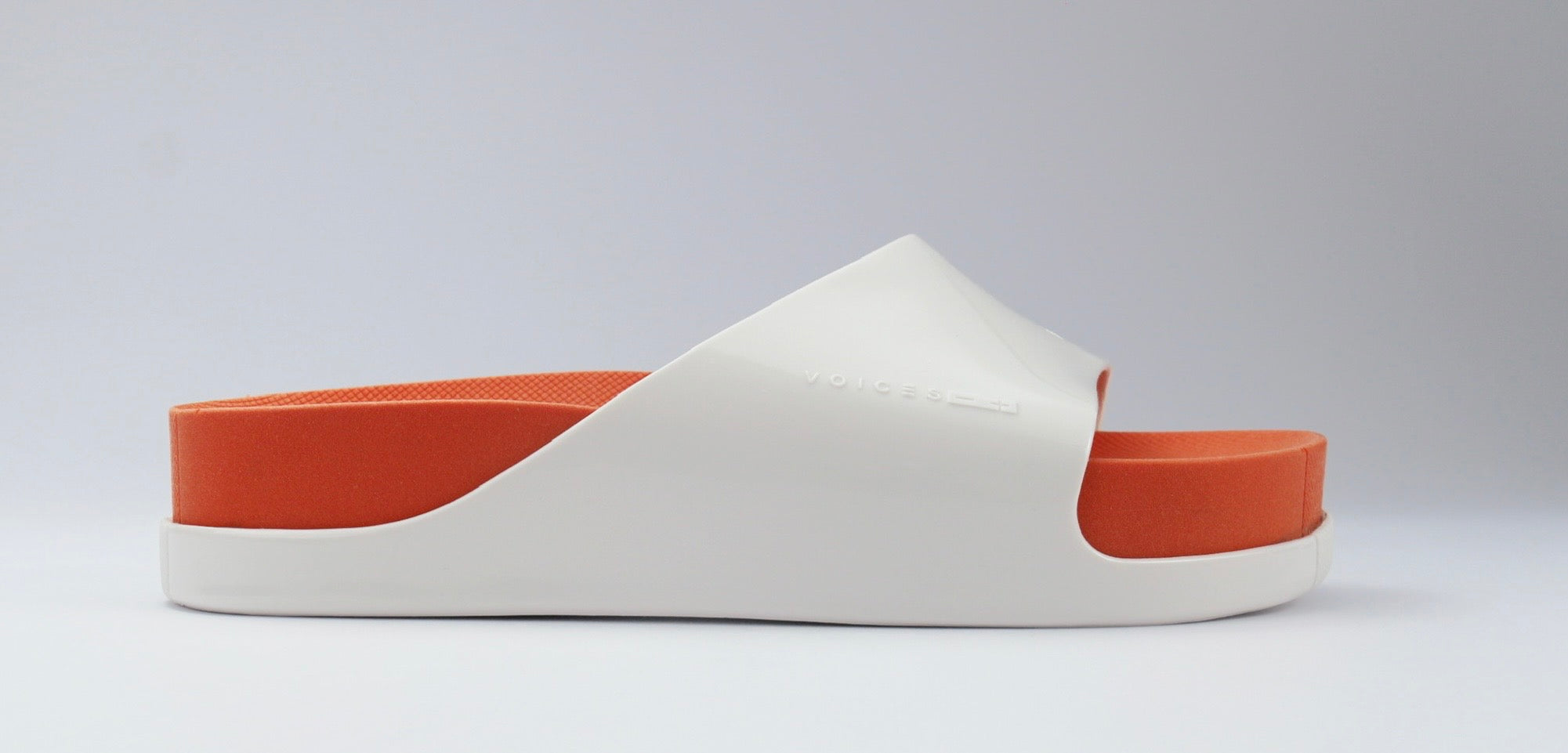 White sandal with a red sole close-up