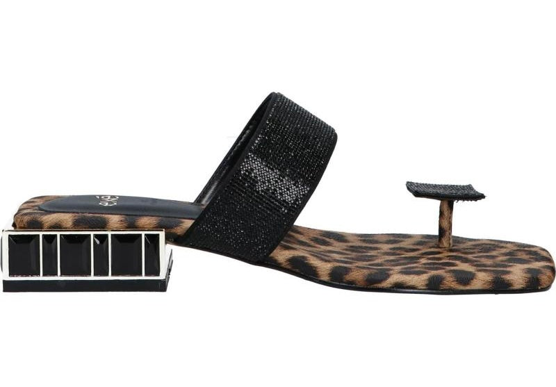 Black sandal with leopard print sole close-up