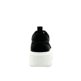 Black mesh sneaker with a white sole heel
