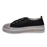 Black sneaker with gray sole side