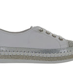 Gray sneaker with rhinestone details close-up