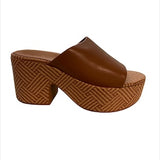 Brown platform sandal with woven sole close-up