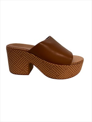 Brown platform sandal with woven sole close-up