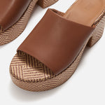 Brown platform sandal with woven sole top