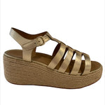 Gold sandal with platform sole close-up