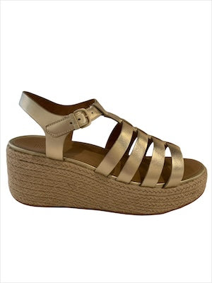 Gold sandal with platform sole close-up