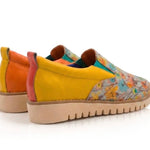Yellow slip-on shoe with floral pattern pair heel