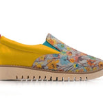 Yellow slip-on shoe with floral pattern close-up