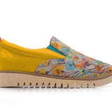 Yellow slip-on shoe with floral pattern close-up