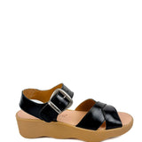 Black sandal with a brown sole close-up