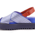 Blue and white striped sandal with a brown strap on a white background