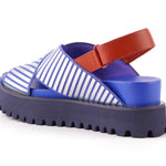 Blue and white striped sandal with a brown strap on a white background