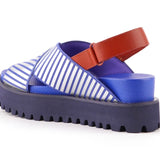 Blue and white striped sandal with a brown strap on a white background