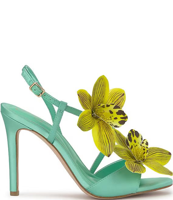 Mint green high-heeled heel with yellow floral decorations close-up