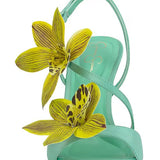 Mint green high-heeled heel with yellow floral decorations front