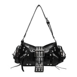 A black studded leather shoulder bag with multiple zippers, a long shoulder strap, and a decorative front strap detail with silver studs and buckles