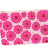 Colorful beaded pouch with pink floral pattern close-up