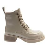 A single light beige patent leather lace-up ankle boot with a chunky ribbed block heel and metal eyelets, shown from a side profile on a white background.