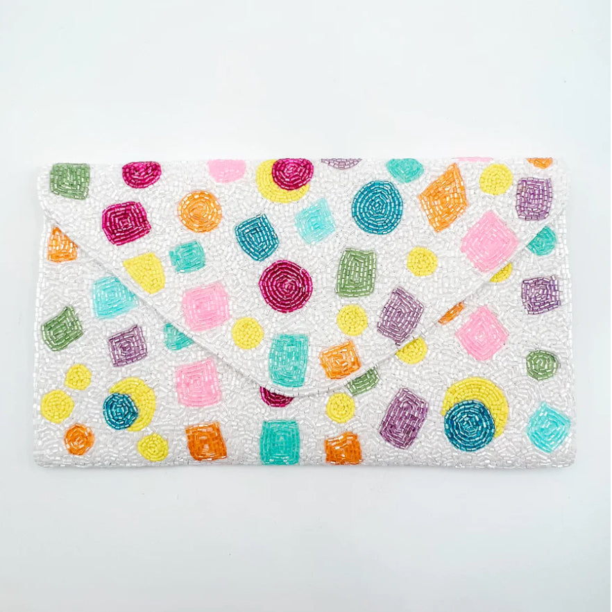 Colorful patterns on a white pouch close-up
